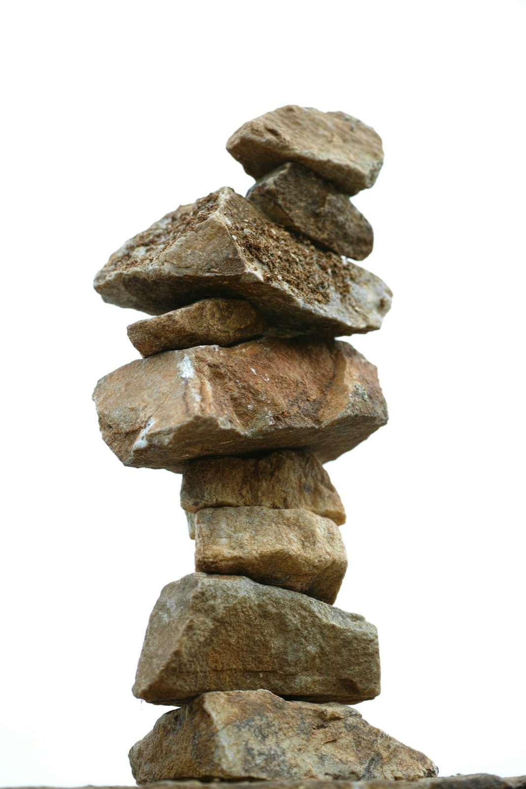Smooth stones stacked in balance, lit by soft natural light